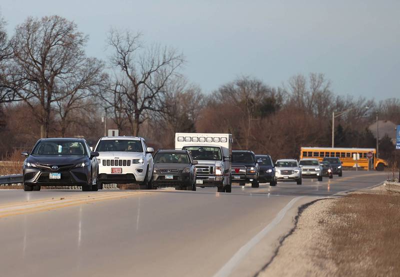 Vehicles travel down Peace Road just north of State Route 64 Tuesday, Jan. 7, 2025, in Sycamore. The DeKalb County Highway Department is seeking funds to widen the road and replace a bridge at this location.