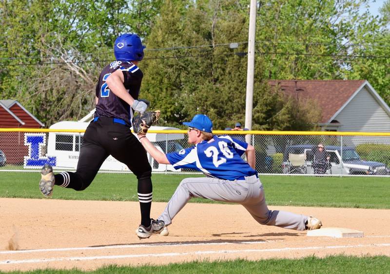 Newman's Daniel Kelly tries to beat out a throw to Princeton first baseman Jace Stuckey on Tuesday. The Comets won 3-2.