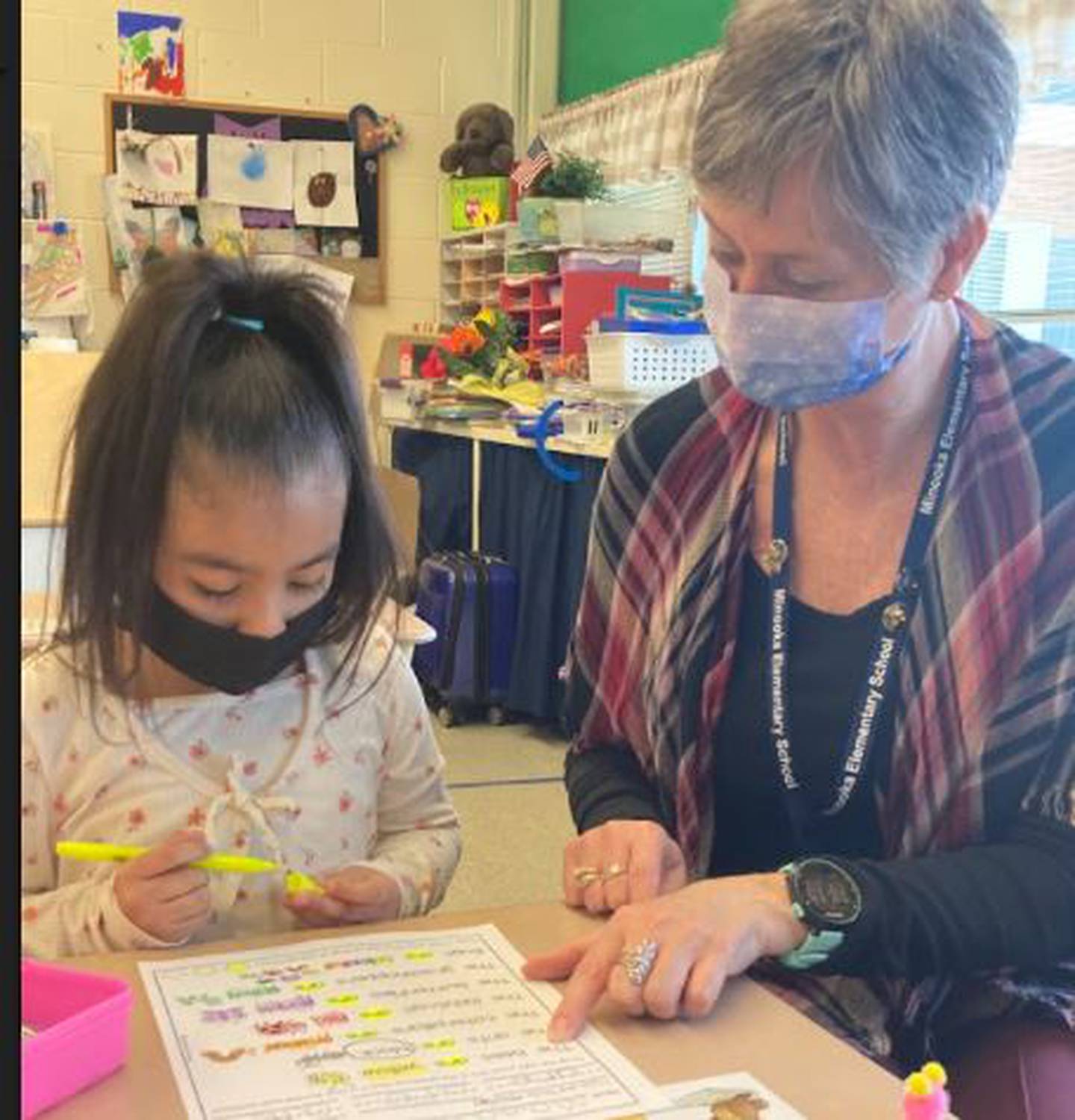 Sara Smith, a teacher in Minooka School District 201's multilingual program, helps Anita Magali find sight words as part of her literacy block.