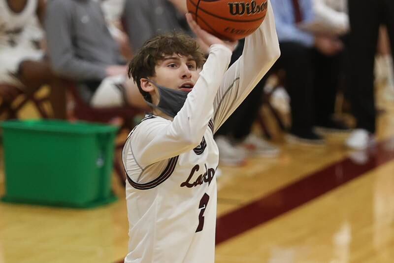 Lockport’s Dominic Crapia puts up a three point shot against Joliet Central. Monday, Jan. 31, 2022 in Lockport.