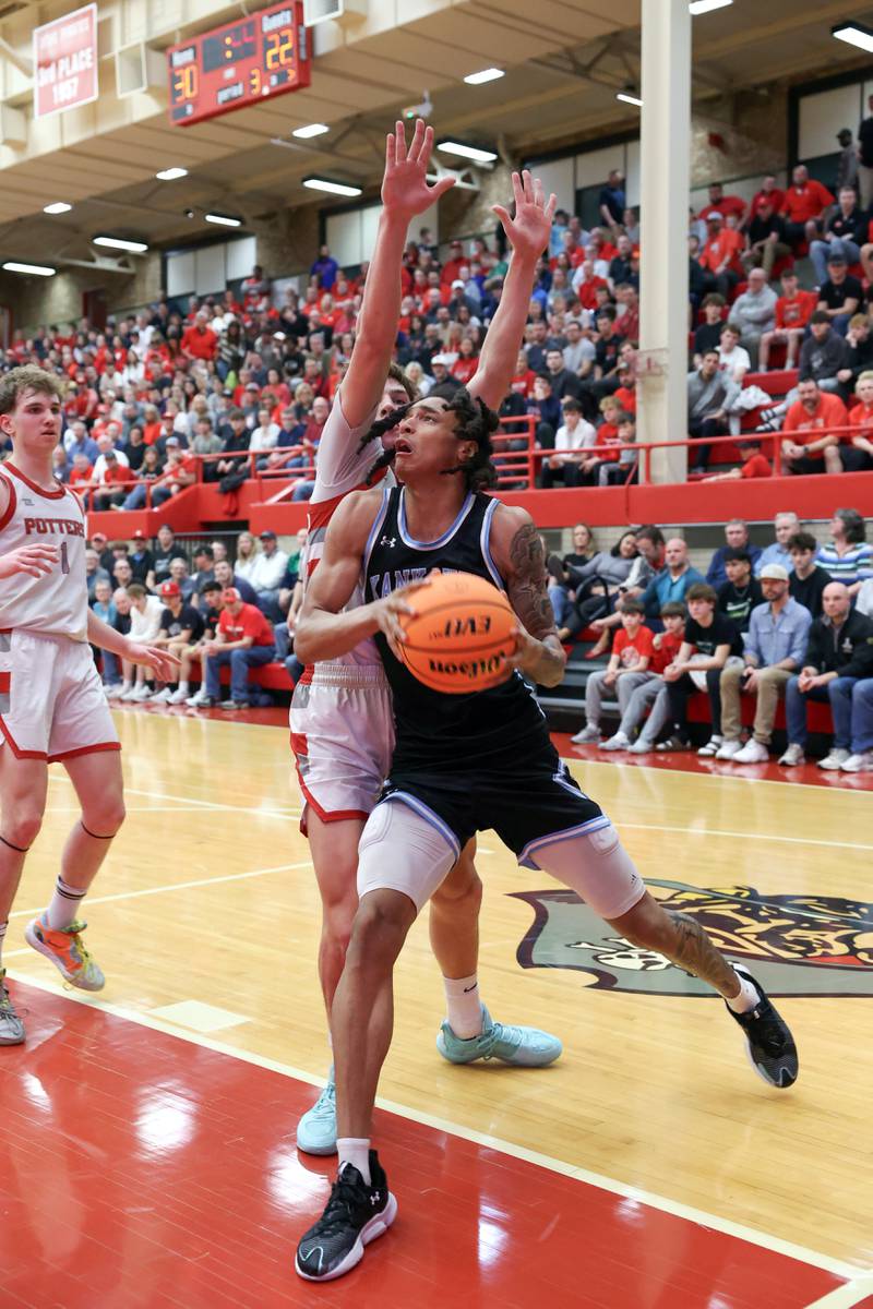 Kankakee's Lincoln Williams drives to the hoop during the Kays' 61-48 loss to Morton in the IHSA Class 3A Ottawa Sectional championship on Friday, March 6, 2026.