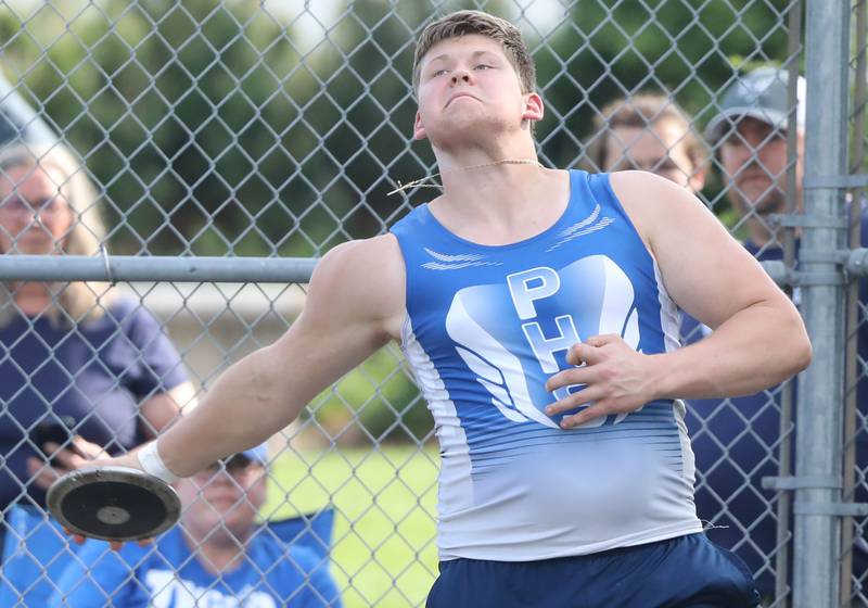 Princeton's Bennett Williams throws the discus in Friday's TRAC Meet at Princeton.