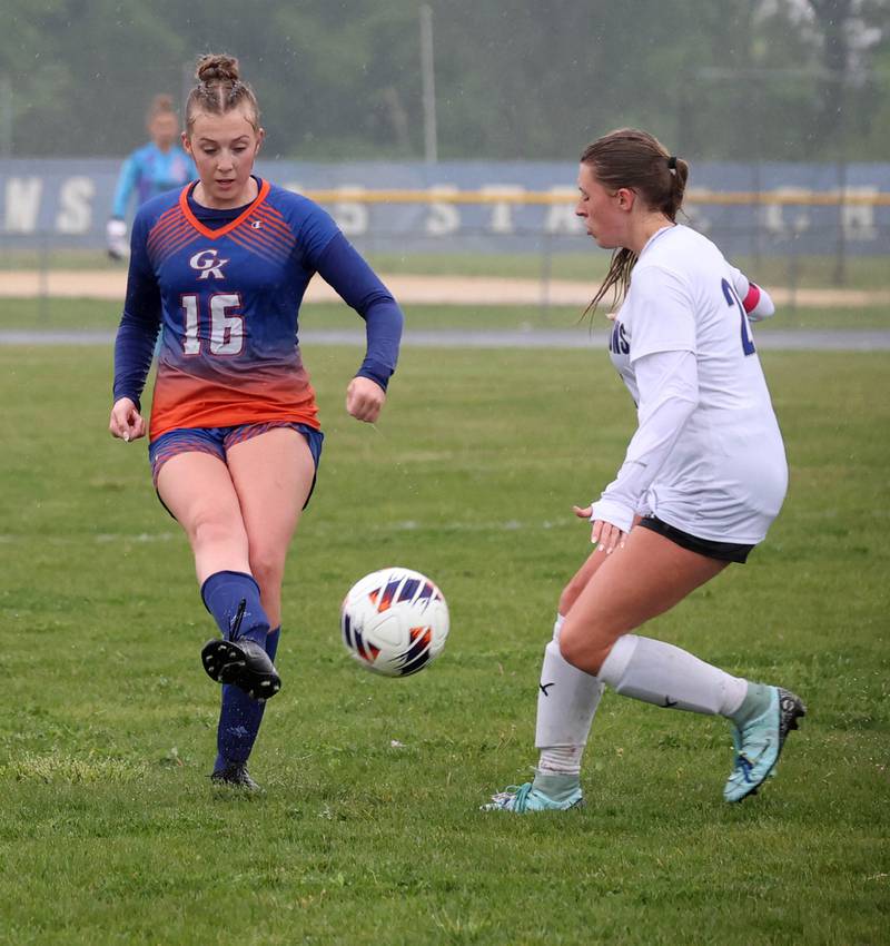 Genoa-Kingston's Ally Poegel kicks the ball past Rockford Christian's Lydia Sherburne Tuesday, May 20, 2025, during their Class 2A regional final game at Rockford Christian High School.