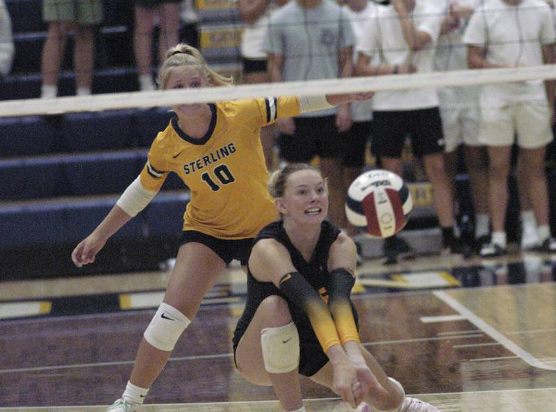 Sterling's Kasey Weeks returns a serve as Grace Springman backs her up.. Sterling hosted Dixon in Volleyball on August 26, 2025 at Musgrove Fieldhouse.