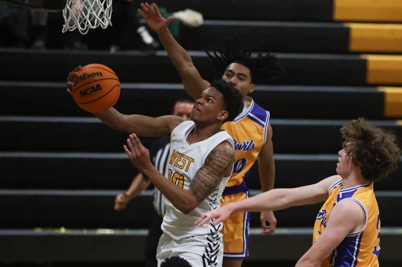 Joliet West’s Zion Gross lays in a shot against Warren on Saturday, Jan.11, 2025 in Joliet.