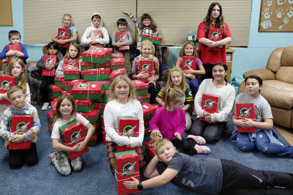 Sandwich church program members fill Christmas boxes