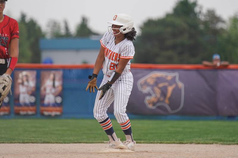 Oswego’s Jaelynn Anthony (20) celebrates after reaching base against Yorkville during a softball game at Oswego High School on Thursday, May 15, 2025.