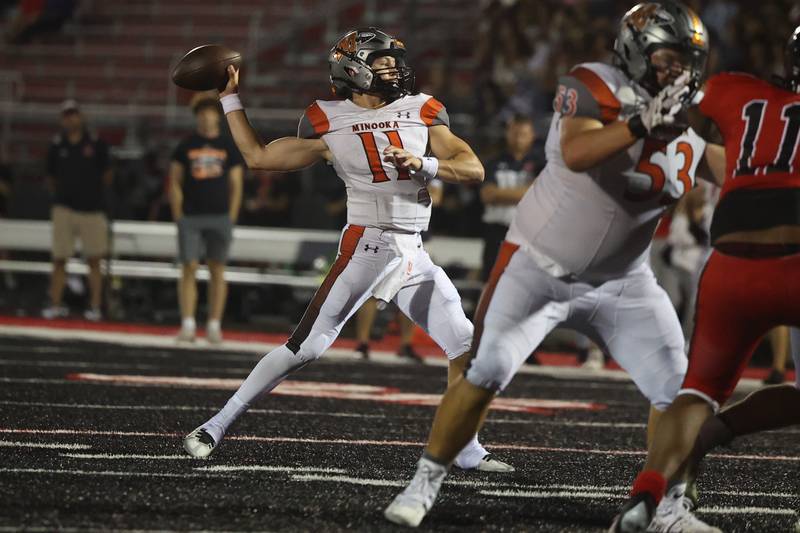 Minooka’s Gavin Dooley makes a pass against Bolingbrook. Friday, Aug. 26, 2022, in Bolingbrook.