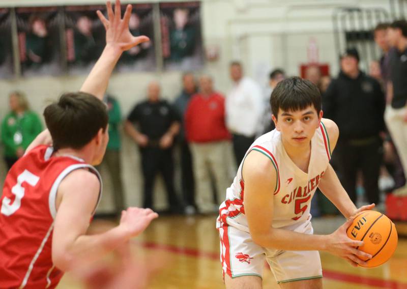 L-P's Erick Sotelo looks to pass the ball around Ottawa's Klyer Araujo on Friday, Feb. 7, 2025 in Sellett Gymnasium at L-P High School.