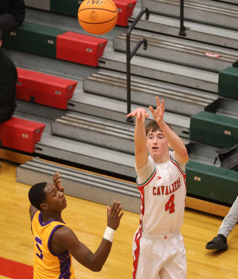 L-P's John Sowers lets go of a shot against Rantoul's Iysean Autman on Friday, Dec. 19, 2025 in Sellett Gymnasium at L-P High School.