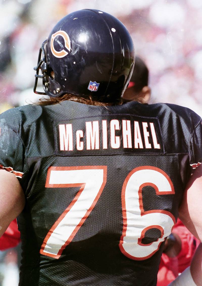 Chicago Bears defensive lineman Steve McMichael watches from the sidelines during a game in 1990.