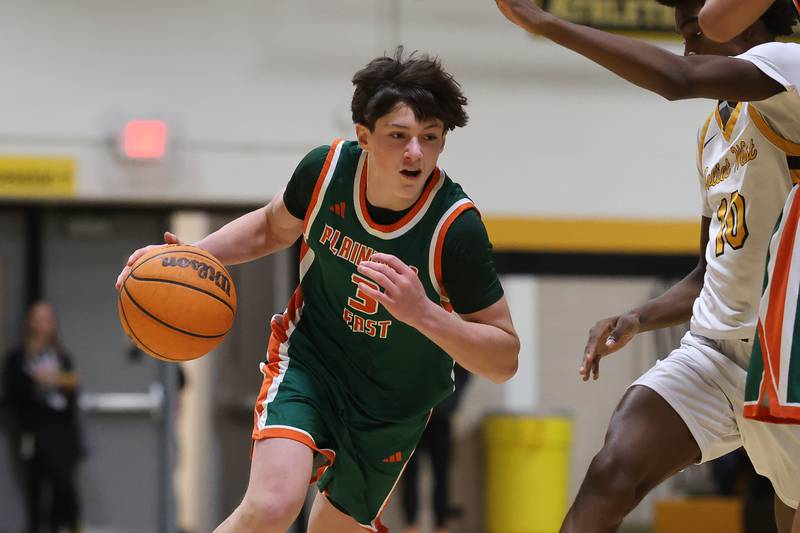 Plainfield East’s Andrew Rudd looks to make a play against Joliet West on Friday, Dec. 19, 2025 in Joliet.
