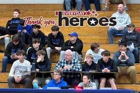 Longtime ‘Blue Streak’ and voice of Woodstock basketball is beloved by high school students, staff