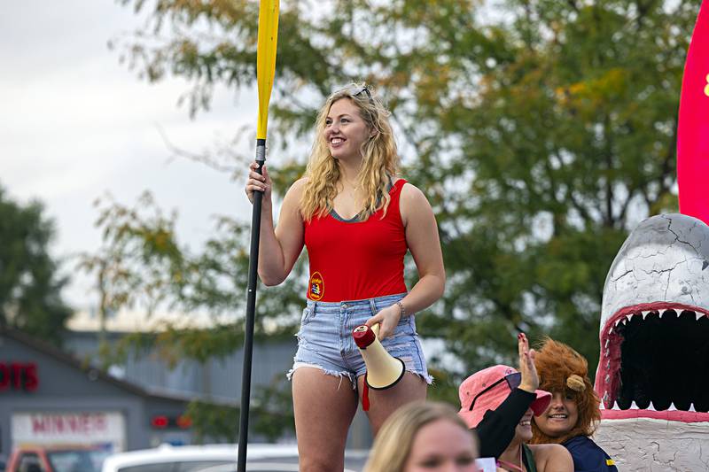 Nicolette Udell plays her best Hasselhoff Thursday, Sept. 21, 2023 as she rides the senior float in the Rock Falls homecoming parade. The school chose a beach theme for this year’s homecoming.