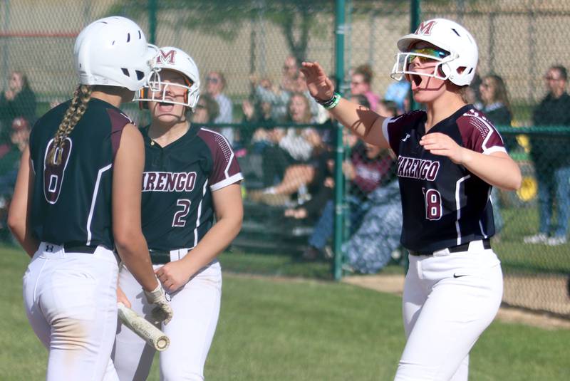 Marengo’s AJ Pollnow, right, and the Indians celebrate against Aurora Central Catholic in IHSA Class 2A Regional Title Game action softball at Marengo High School in Marengo on Friday, May 23, 2025.