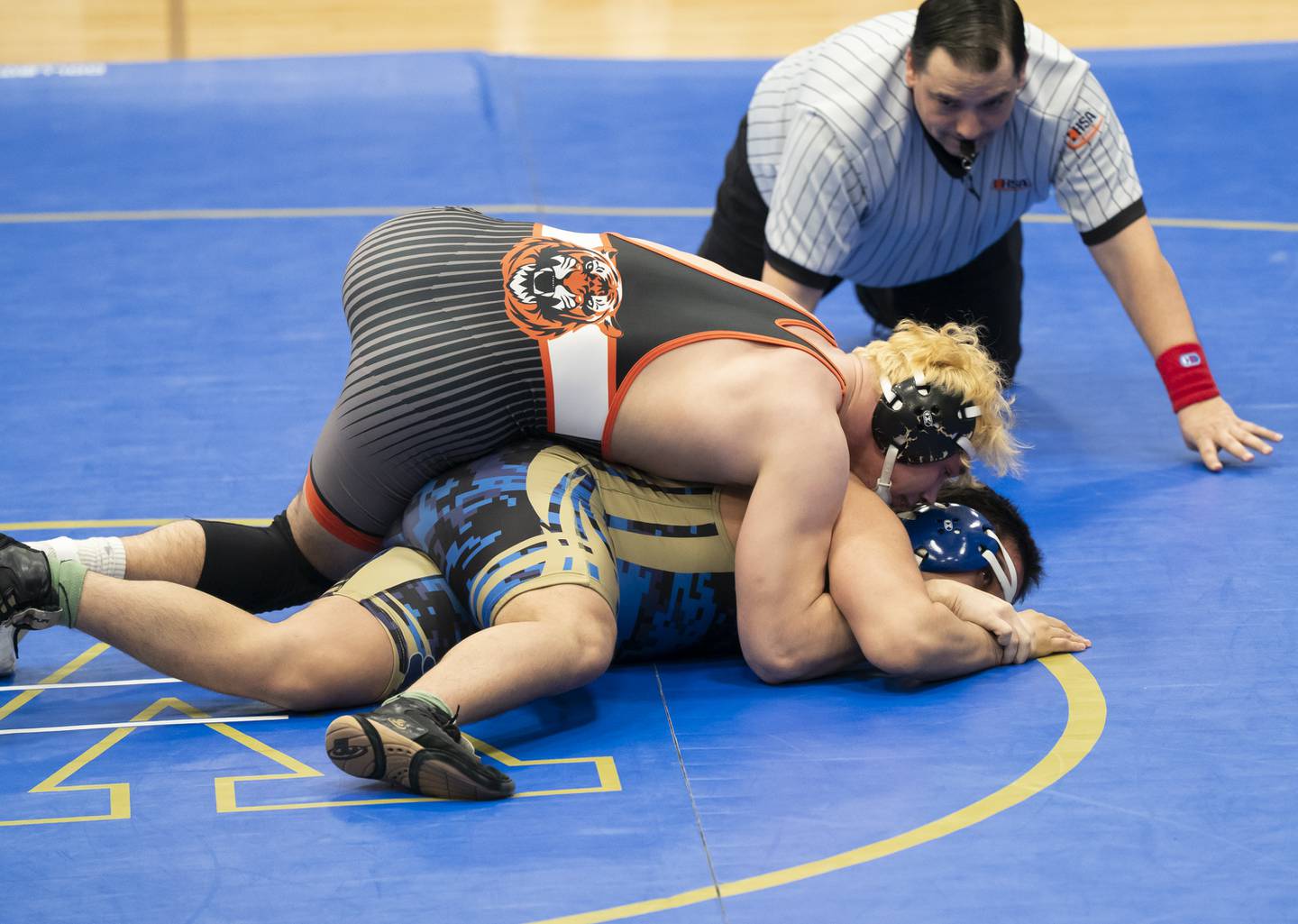 Crystal Lake Central's Cayden Parks, top, wrestles with Wheeling's Jonny Dominguez in the 190 pound bout during the Class 2A Dual Team wrestling Sectional on Tuesday, February 25, 2025 at Wheeling High School. Ryan Rayburn for Shaw Local