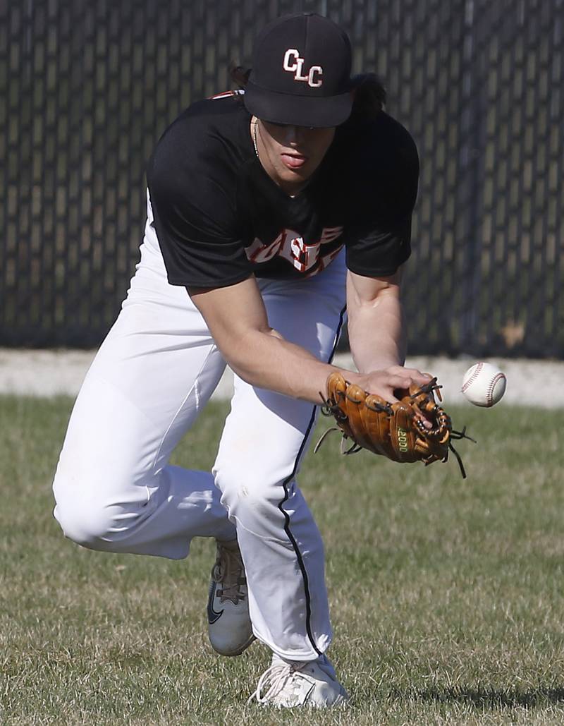 Crystal Lake Central's Connor Gibour tries to field the ball during a Fox Valley Conference baseball game against Jacobs Monday, April 10, 2023, at Crystal Lake Central High School.