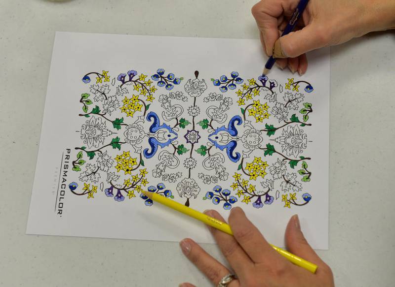 Intricate designs are available online for adults interesting in coloring. More than a dozen people tried out the new activity during event at the Geneva Public Library.