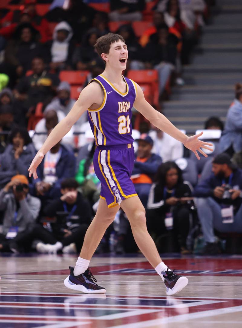 Downers Grove North's Jack Stanton (21) starts to celebrate during the boys 4A super-sectional game between Kenwood Academy and Downers Grove North high school in Chicago on Monday, March 6, 2023.