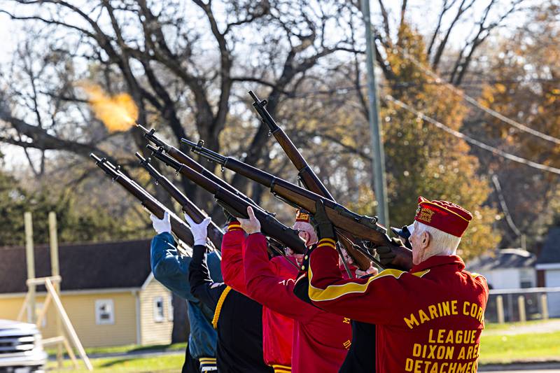The Marine Corps auxiliary performs a rifle salute Saturday, November, 11, 2023 during a ceremony at the Veterans Park in Dixon in recognition of Veterans Day.