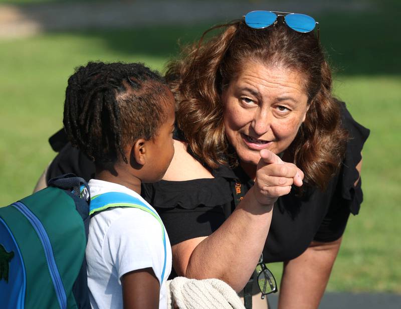 Lincoln Elementary School Principal Jennifer Tallitsch helps a student find their teacher as kids arrive for the first day of classes Wednesday, Aug. 14, 2024, at the school in DeKalb.
