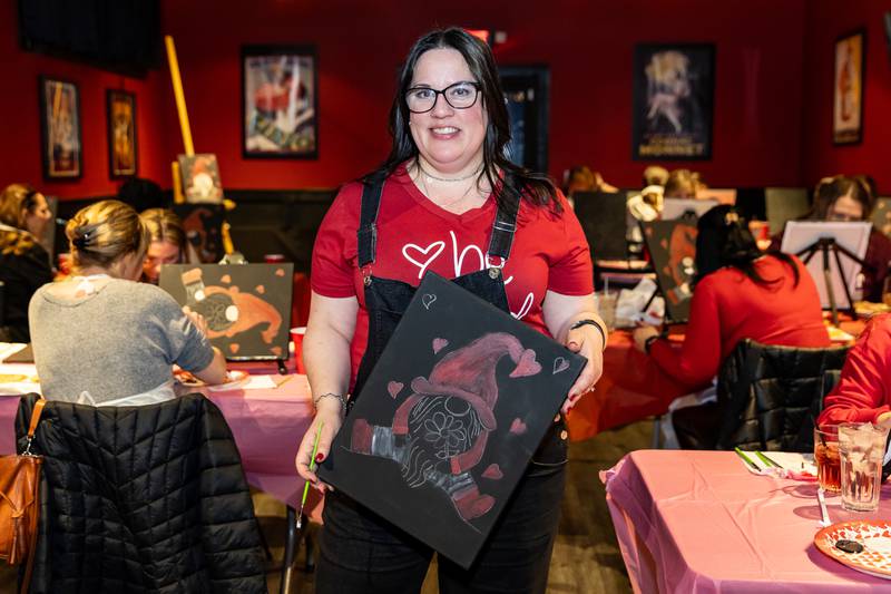 Divine Design Paint Studio owner and artist, Annie Flint, hosts a paint party at Papa Joe's in Lockport on Feb. 6, 2025.