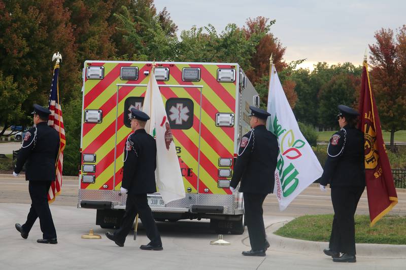 The honor guard walks in formation, hoisting flags Thursday, Sept. 11, 2025, during the DeKalb Fire Department's annual Patriot Day Ceremony.