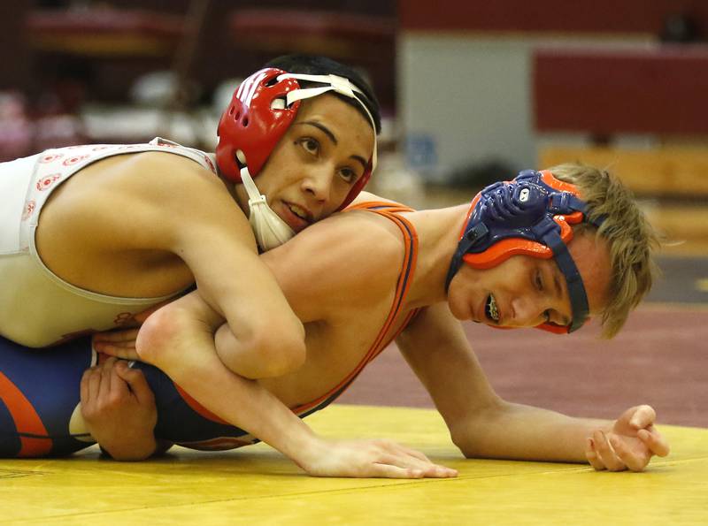 Marian Central Andrew Alvarado controls Genoa-Kingston’s Hayden McNew during their 113-pound championship wrestling match in the IHSA 1A Richmond-Burton Wrestling Regional Thursday, Jan. 19, 2023, at Richmond-Burton High School in Richmond.