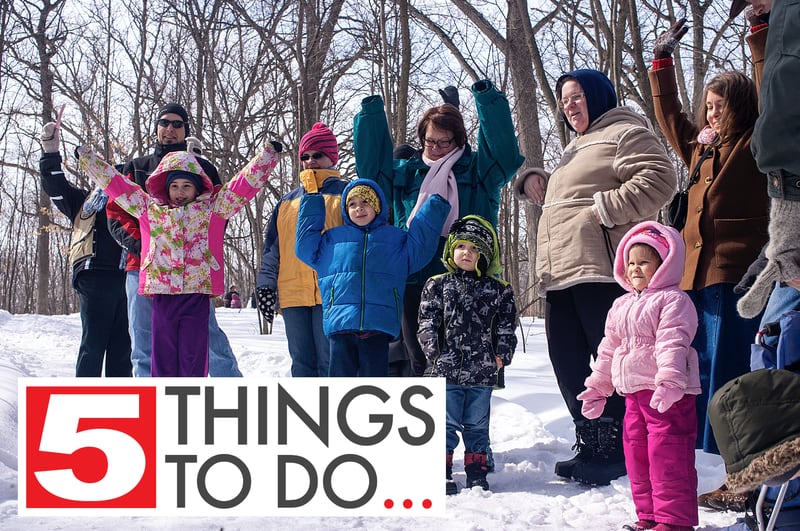 A group of participants demonstrate the different shapes of trees Saturday, March 8, 2014, during the annual Festival of the Sugar Maples at Coral Woods Conservation Area in Marengo.