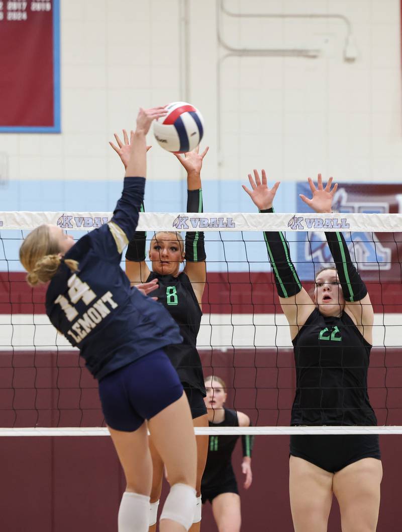 Providence's Demi Carbone (8) and Grace Lustig jump to block a hit by Lemont's Kaitlyn Wilson during Providence's victory in two sets, 25-25, 25-18, over Lemont in the IHSA Class 3A Kankakee Sectional championship on Thursday, Nov. 6, 2025.