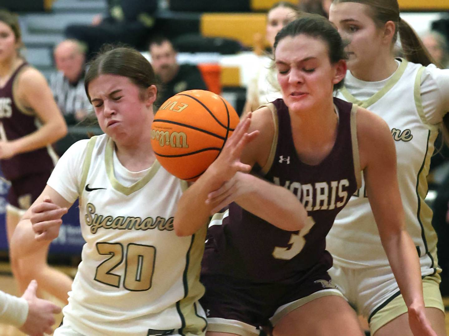 Sycamore's Callie Countryman and Morris' Lily Hansen fight for a loose ball during their game Tuesday, Jan. 13, 2026, at Sycamore High School.