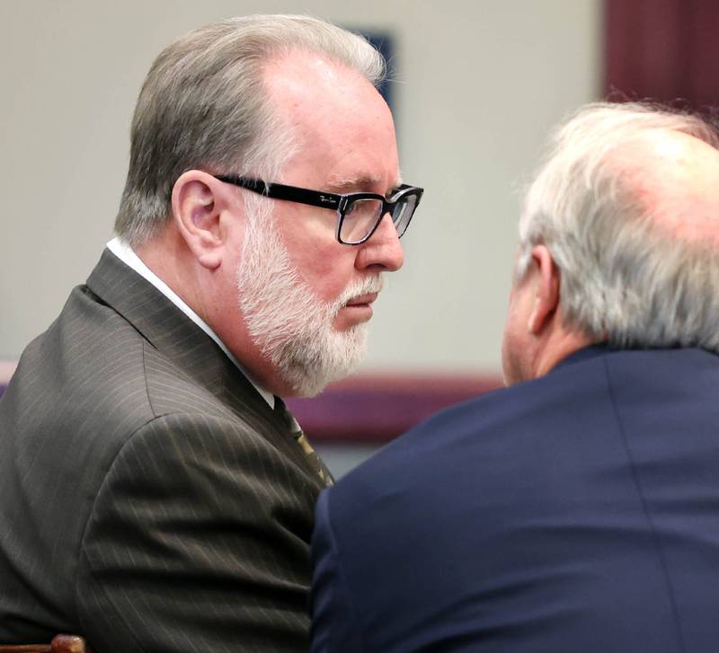 Former DeKalb School District 428 Superintendent Douglas Moeller talks to his attorney Clay Campbell during his trial Wednesday, Oct. 5, 2022, at the DeKalb County Courthouse in Sycamore. Moeller was charged in April 2018 with non-consensual dissemination of private sexual images, a class 4 felony.