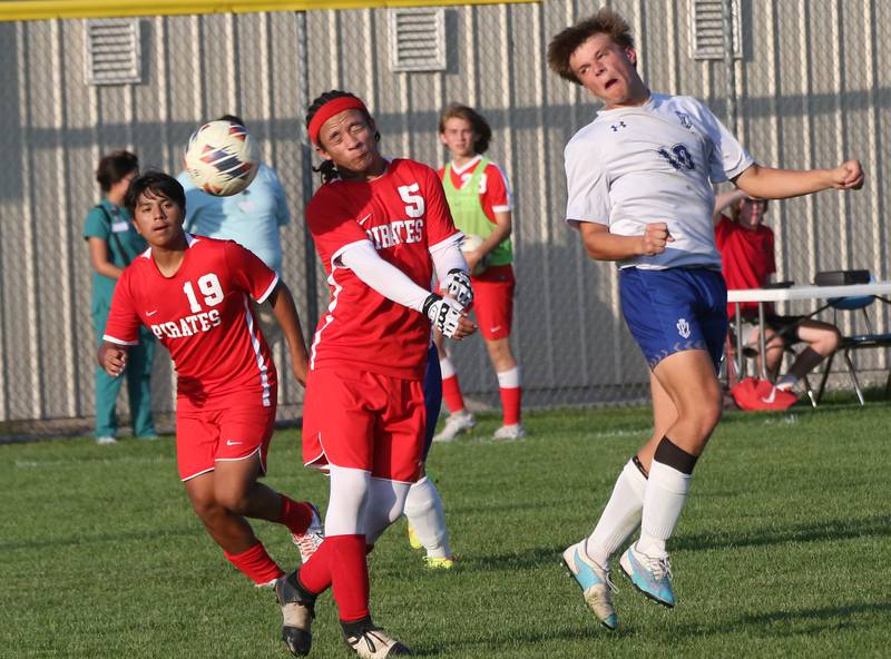 Ottawa's Malikhai Stayton and Princeton's Josh Orwig miss a header while trying to advance the ball down the field on Tuesday, Oct. 3, 2023 at Ottawa High School.