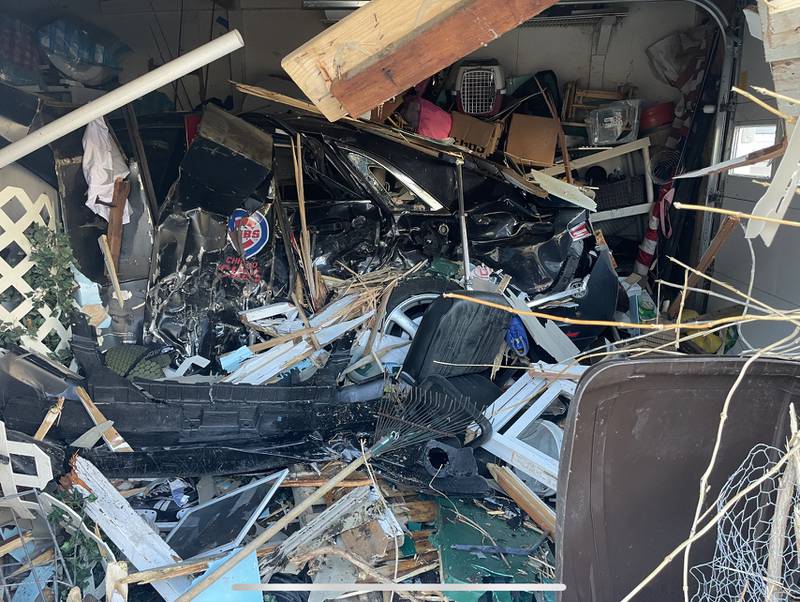 Inside the garage of Danielle Irwin's Crystal Lake home after vehicle crashed into it on Monday, March 20, 2023, causing damage to her garage, car and belongings.