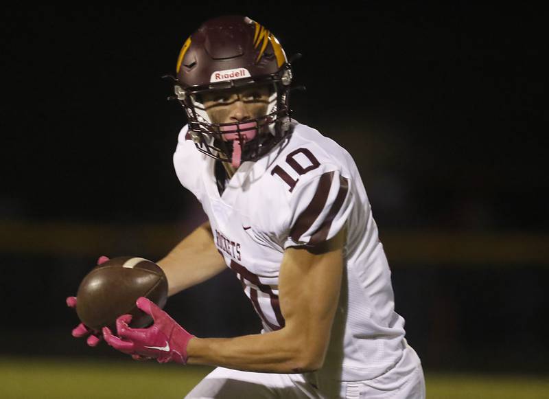 Richmond-Burton's Max Loveall looks to run after acatch during a Kishwaukee River Conference football game against Johnsburg on Friday, Oct.6, 2023, at Johnsburg High School.