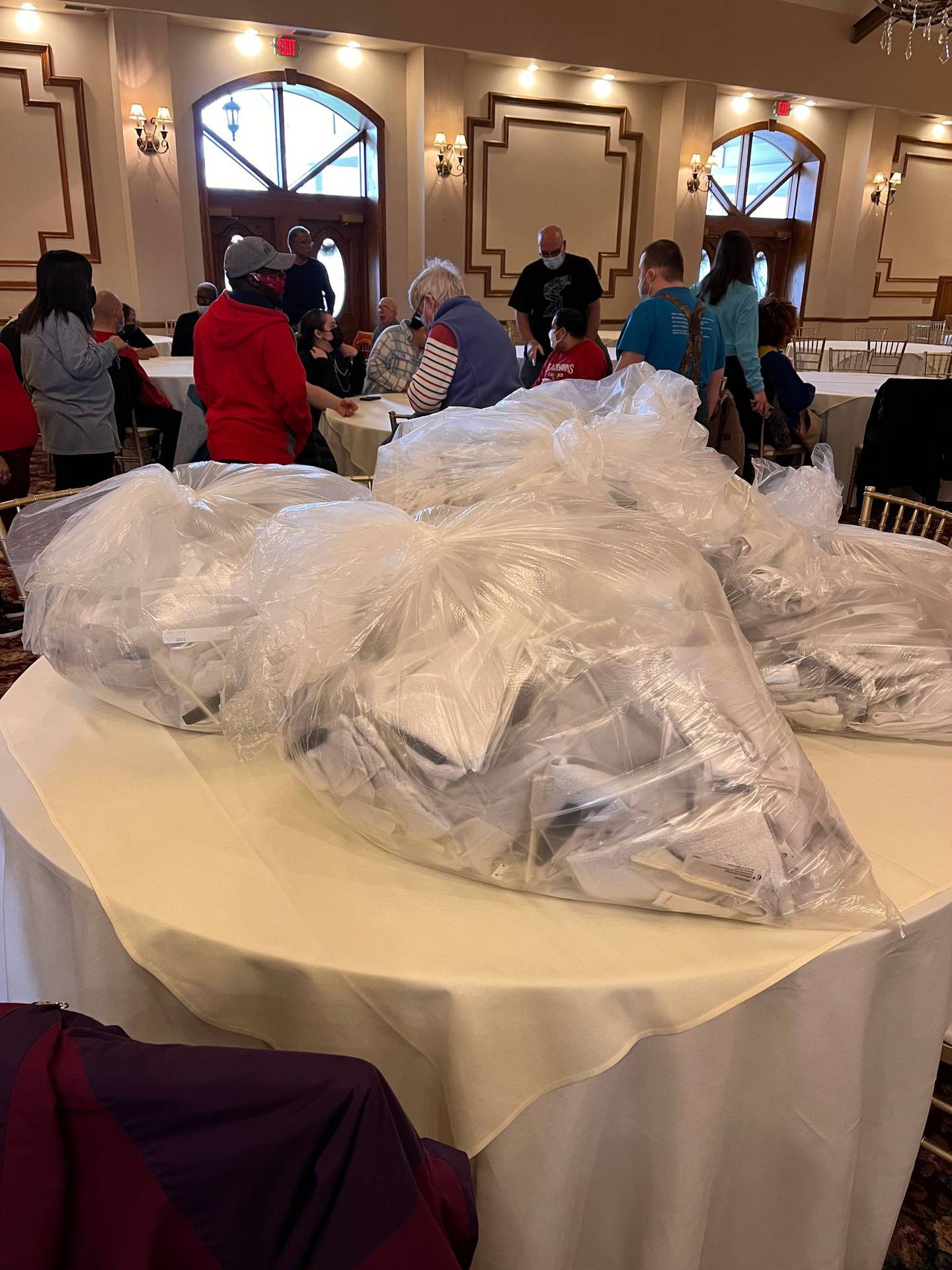 Members of multiple Joliet-area organizations, including All Saints Greek Orthodox Church in Joliet, the Kiwanis Club of Joliet, the Kiwanis’ Aktion Club and Aktion Angels Club and the Greater Joliet Area YMCA, worked together to purcahse the items for and then assemble hundreds of hygiene kits for the Ukranian refugees. Pictured are volunteers from the packing event at the Jacob Henry Mansion Estate in Joliet.