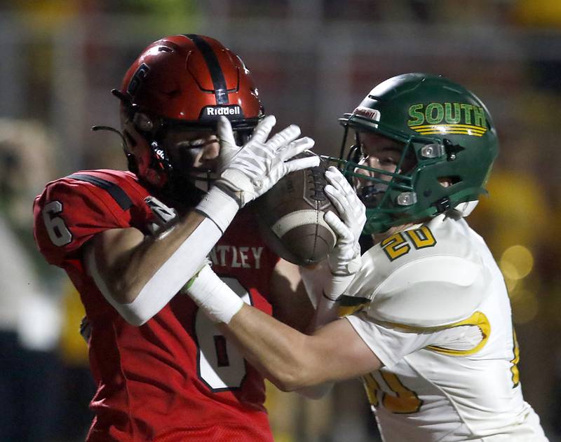Huntley's Jacob Witt catches a touchdown pass in front of Crystal Lake South's Brady Skirpan during a Fox Valley Conference football game on Friday, Sept. 29, 2023, at Huntley High School.