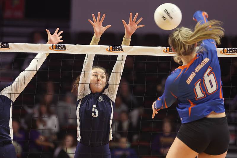 IC Catholic’s Kiely Kemph goes for the block against Genoa-Kingston in the Class 2A championship match on Saturday in Normal.