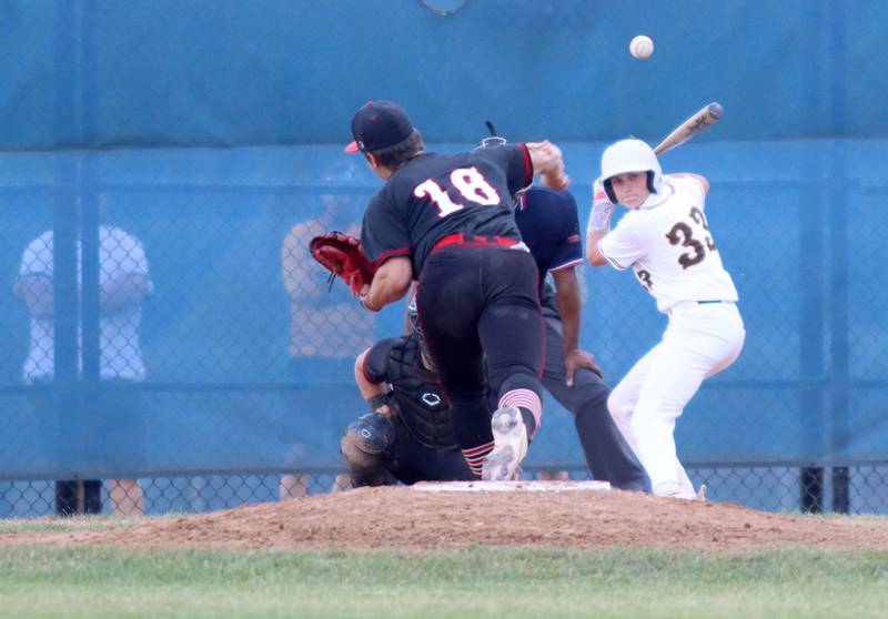 Huntley’s pitcher Malachi Paplanus, right, watches the flight of a home run off the bat of Jacobs’ Christian Graves in Class 4A Sectional baseball action at Carpentersville Wednesday.