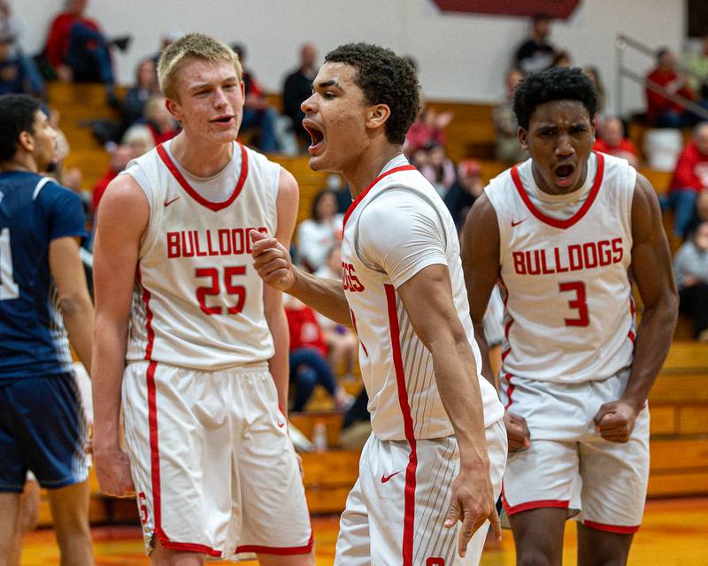 Joseph Hoekstra (25), Lazyeric Moton (1) and Sharon Morton (3) of Streator react after scoring in game against Lisle on Wednesday, Feb. 18, 2026 at Streator High School in Streator.