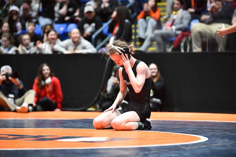 Katelyn Bell of Montini takes a moment after losing the 100-pound championship match in the IHSA Girls Individual State Finals on Saturday, March 1.