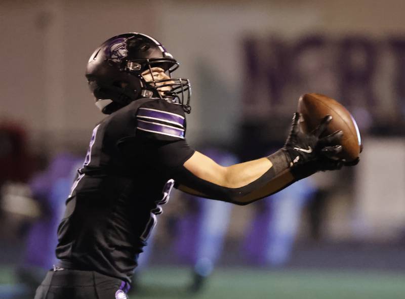 Downers Grove North's Charlie Cruse (11) makes a catch for a touchdown during the 7A first-round playoff game between Wheaton Warrenville South and Downers Grove North high schools on Friday, Nov. 1, 2024 in Downers Grove.