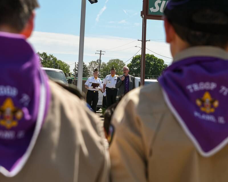 Plano Mayor Mike Rennels speaks during the Memorial Day remembrance ceremony held at Memorial Park in Plano on Monday, May 29, 2023 while members of Plano’s Boy Scouts Troop 71 look on.