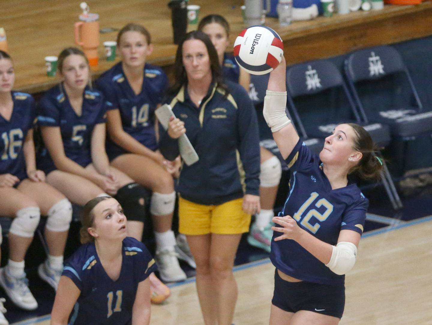 Marquette's Kinley Rick sends the ball to the St. Bede side of the net on Thursday, Sept. 4, 2025 at Bader Gym.