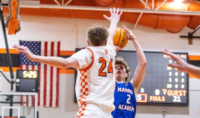 Marmion Academy guard Caden Anderson shoots a two-point field goal during a game against St. Charles East High School on Saturday, Jan. 4, 2025.