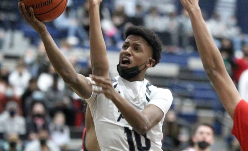 Oswego East’s DeVon Oregon gets the ball to the basket during a home game against West Aurora on Friday, Jan. 28, 2022.