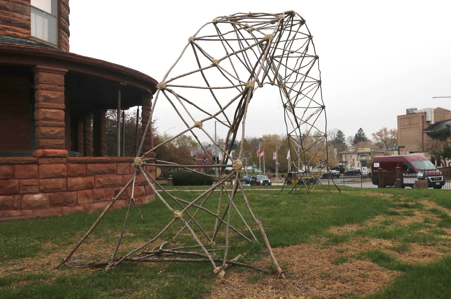 A piece called “Rainbow Bridge” by John Siblik Wednesday, Nov. 8, 2023, on the northwest corner of First Street and Lincoln Highway in DeKalb. The piece is part of the Terrain Biennial 2023, a countrywide exhibit where artists display their work outside of homes and building around town.