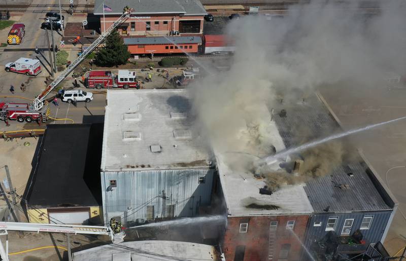 Smoke pours out of an apartment fire in the 800 block of Main Street on Monday, Aug. 22, 2022 in Mendota.