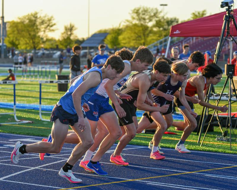 Runners take off during the second heat of the 800 meter run during the Kane County track and field meet held at Marmion Academy in Aurora on Friday May 3, 2024.