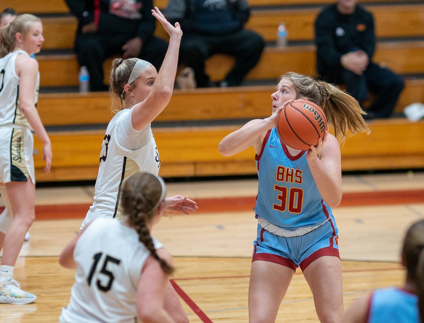 Batavia’s Reagan Sulaver (30) plays the ball in the post against Sycamore's Evyn Carrier (23) during the Batavia MLK Showdown at Batavia High School on Monday, Jan 16, 2023.